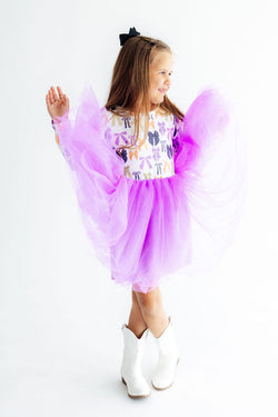 Girl wearing a long sleeve Halloween-themed tutu dress for fall