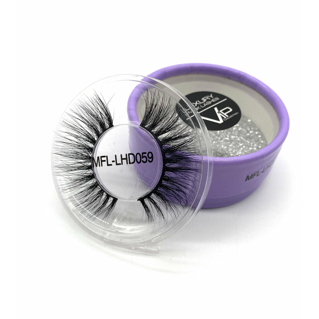 Pair of luxurious mink fur eyelashes displayed in a signature purple box