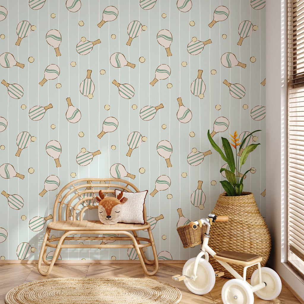 Close up of Ace geometric wallpaper featuring mint green, pale peach, and white lines in a modern nursery setting