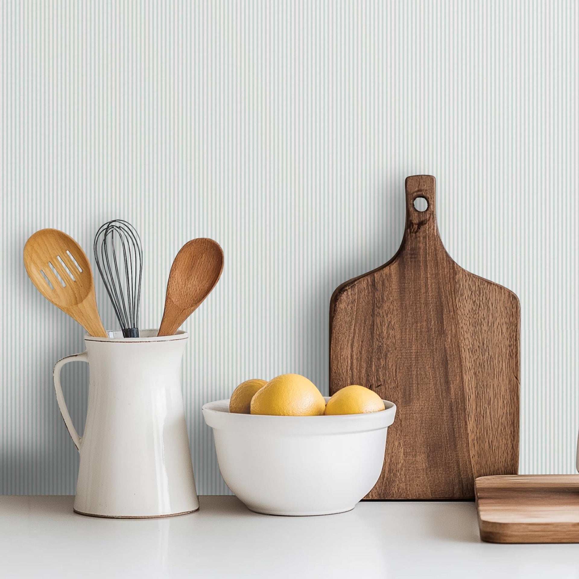Ansel striped wallpaper in white, pale-blue, pale-pink, and pale-yellow.