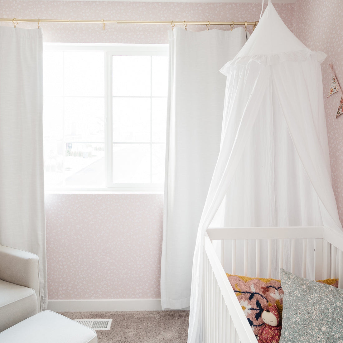 Elsie floral wallpaper featuring a design in pink, blue, and white