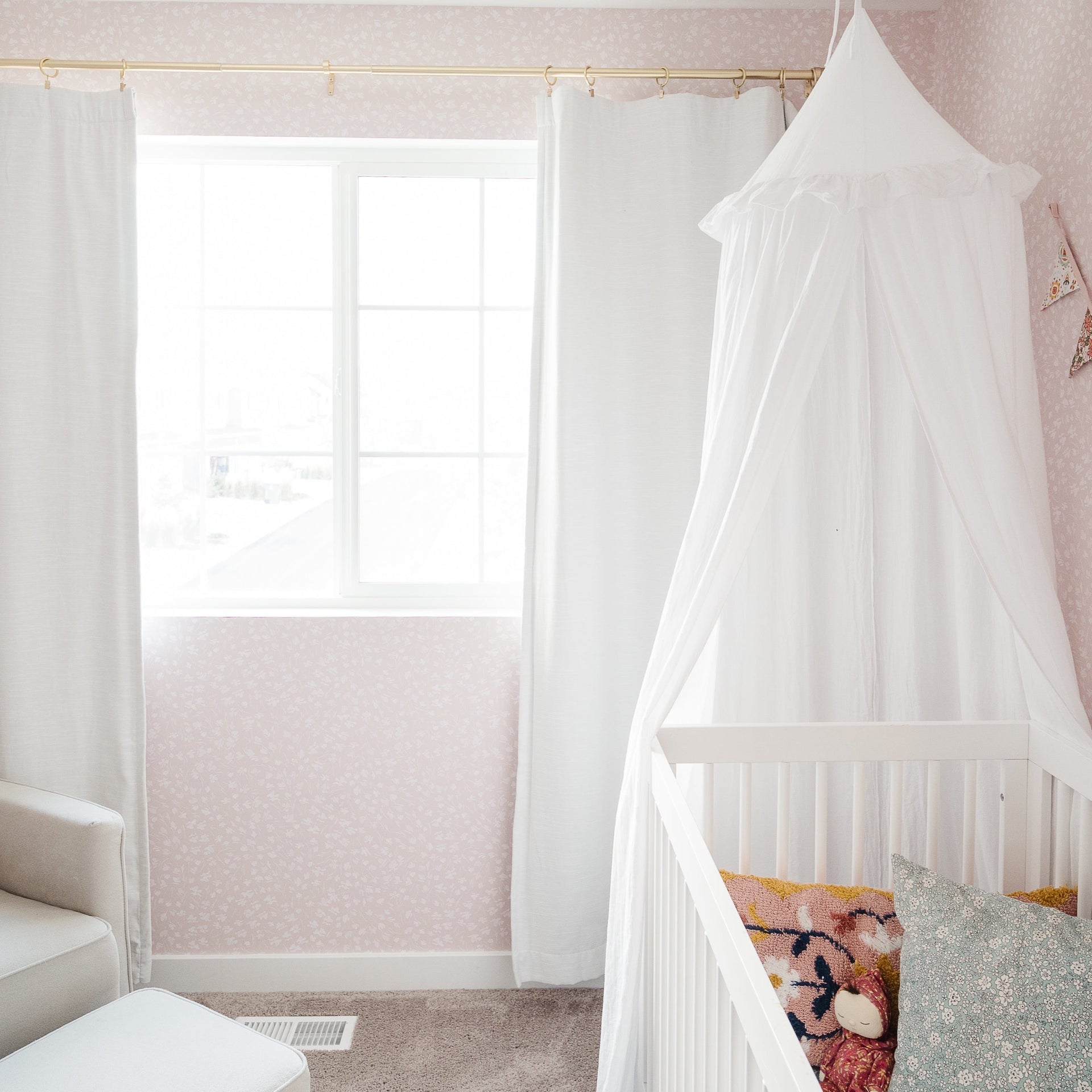 Elsie floral wallpaper featuring a design in pink, blue, and white