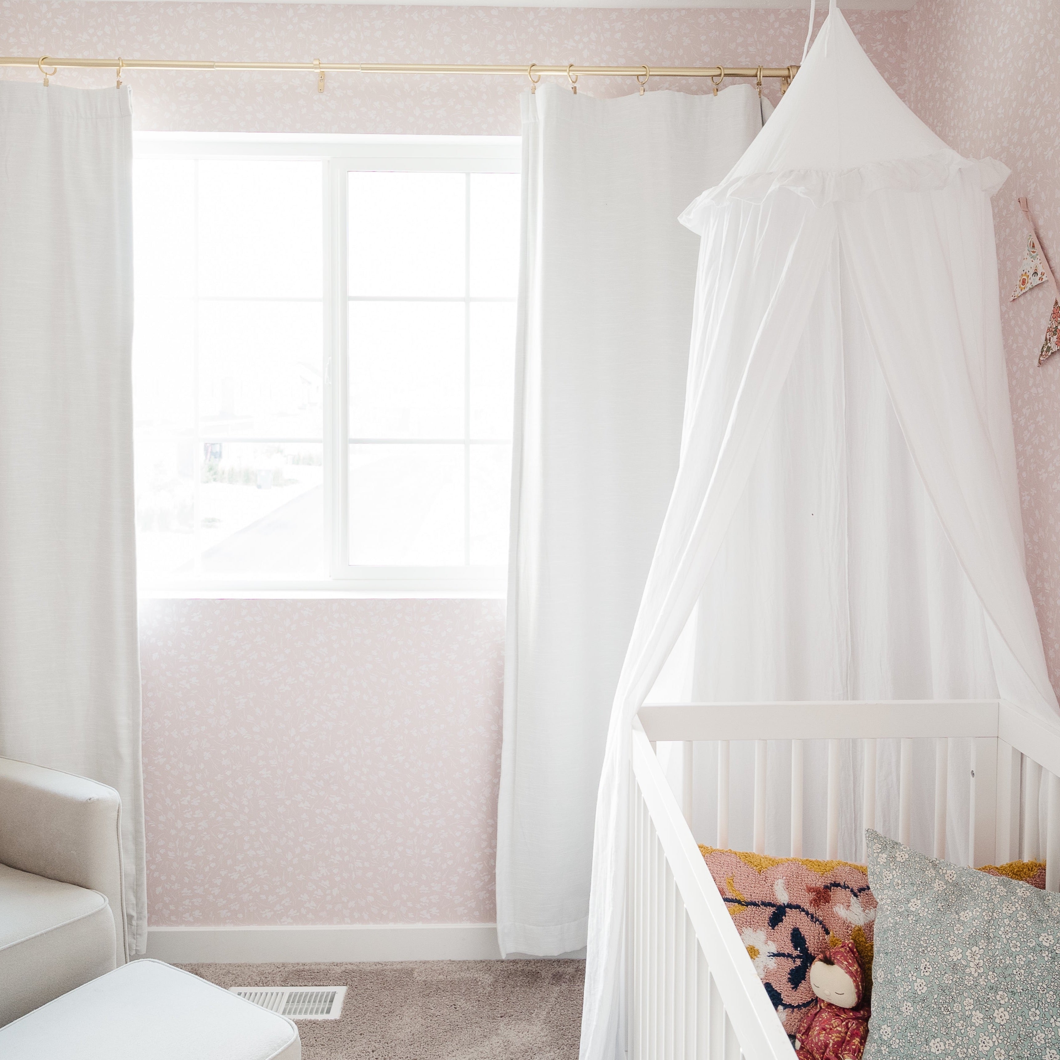 Elsie floral wallpaper featuring a design in pink, blue, and white