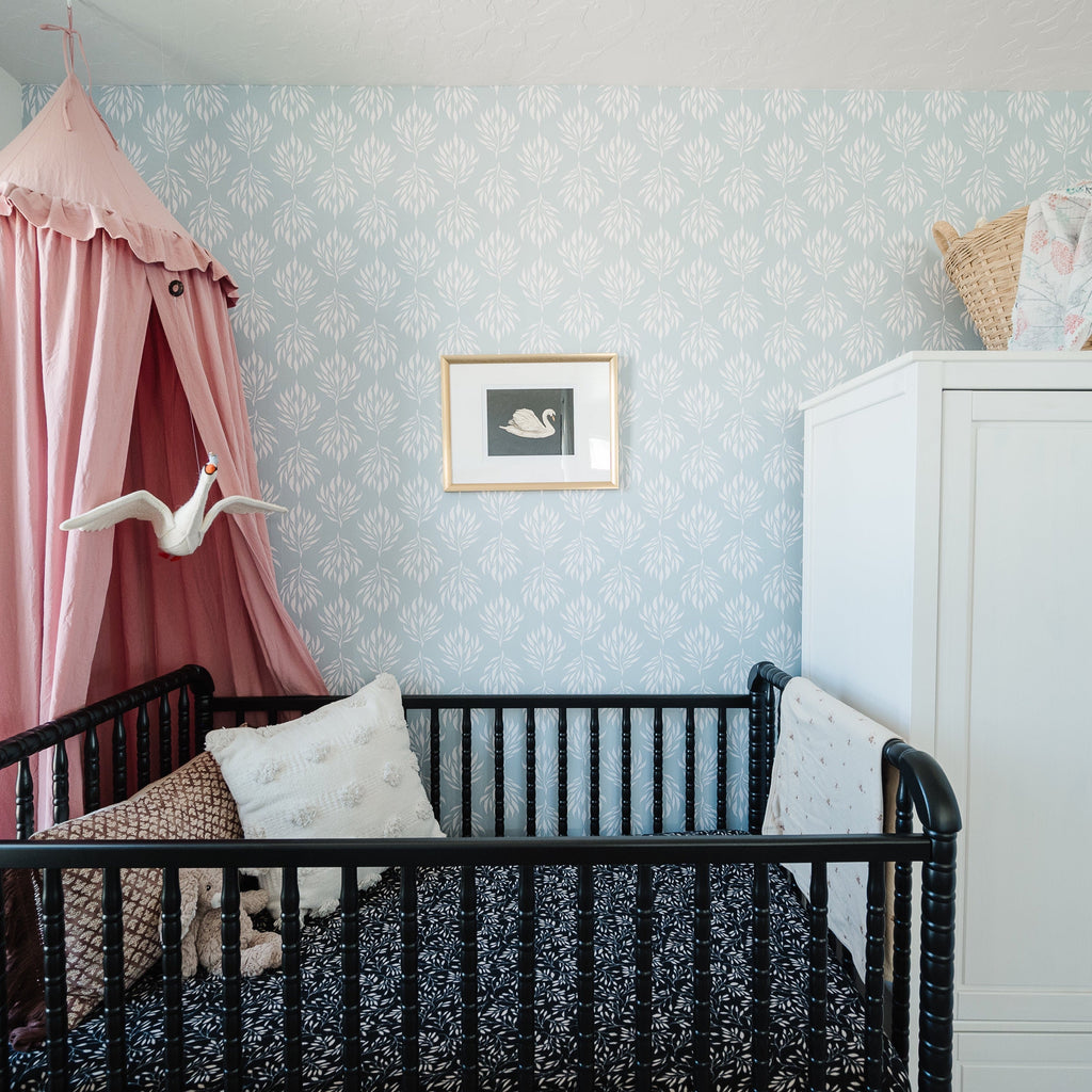Amorette floral wallpaper featuring blue, pink, and mint botanical patterns on a white background.