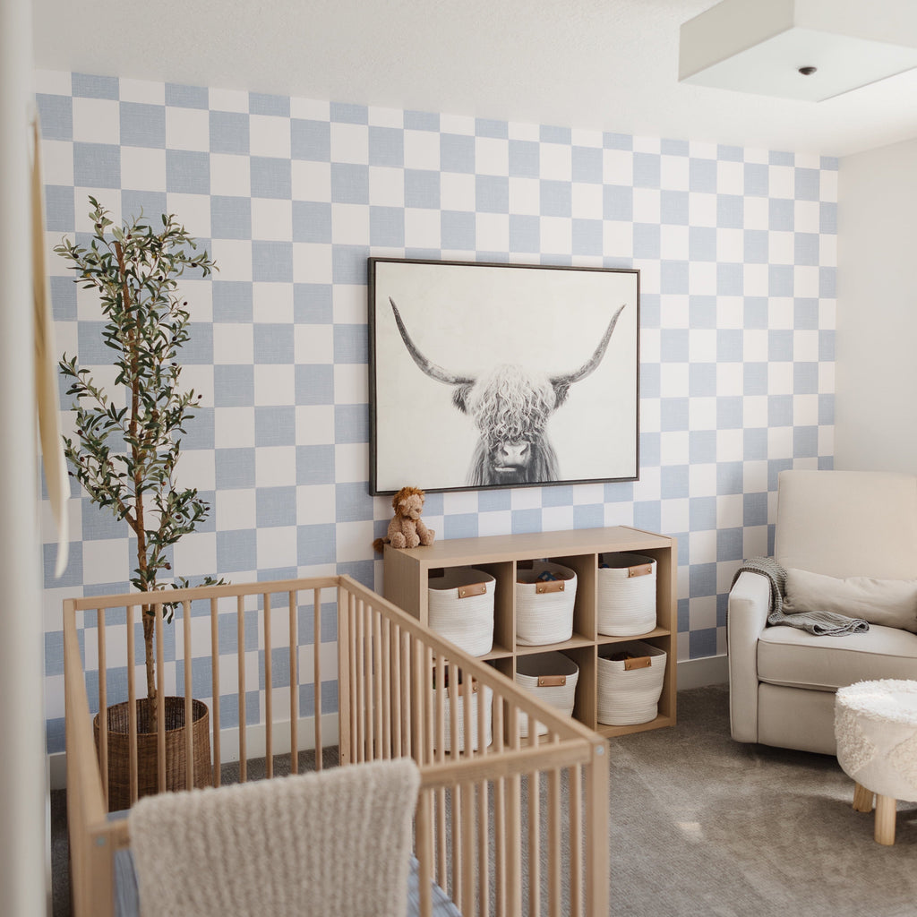 Modern geometric wallpaper in light blue and beige for a minimalist room aesthetic.
