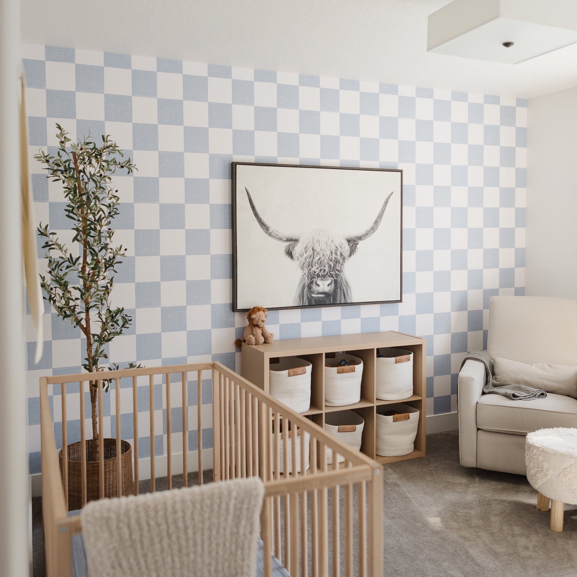 Modern geometric wallpaper in light blue and beige for a minimalist room aesthetic.