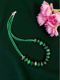 Close up of an elegant Green Onyx necklace on a mannequin for jewelry fashion display