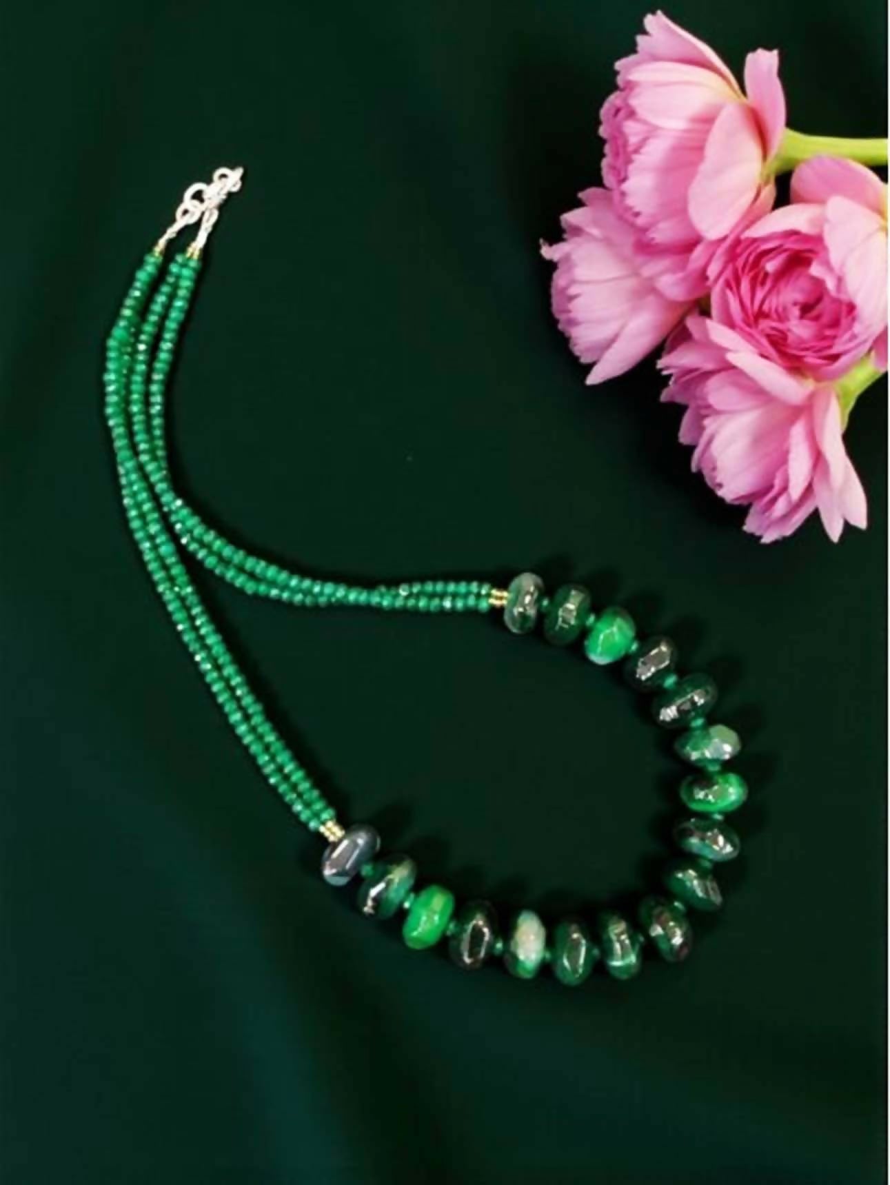 Close up of an elegant Green Onyx necklace on a mannequin for jewelry fashion display
