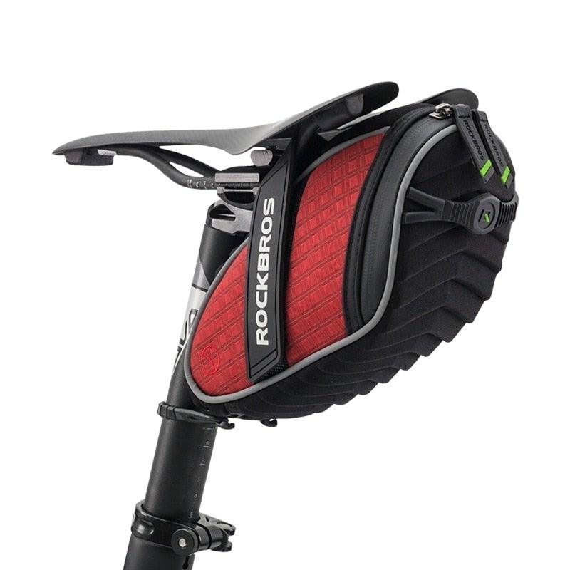 Modern 3D shell waterproof bicycle seat bag in black and red for road and mountain bikes.