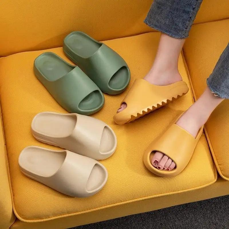 Unisex minimalist slide sandals in olive green, cream, and mustard yellow.