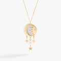 Gold-tone crescent moon and sun pendant necklace with Mother of Pearl and crystals