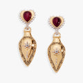 A pair of bohemian-style two-tone potion bottle drop earrings in gold and silver with deep-red gemstones and crystal accents.