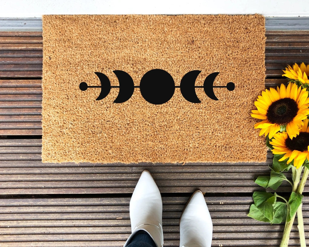 Brown and black Moon Phases doormat with celestial design