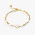 Gold chain bracelet featuring a white Mother of Pearl daisy charm