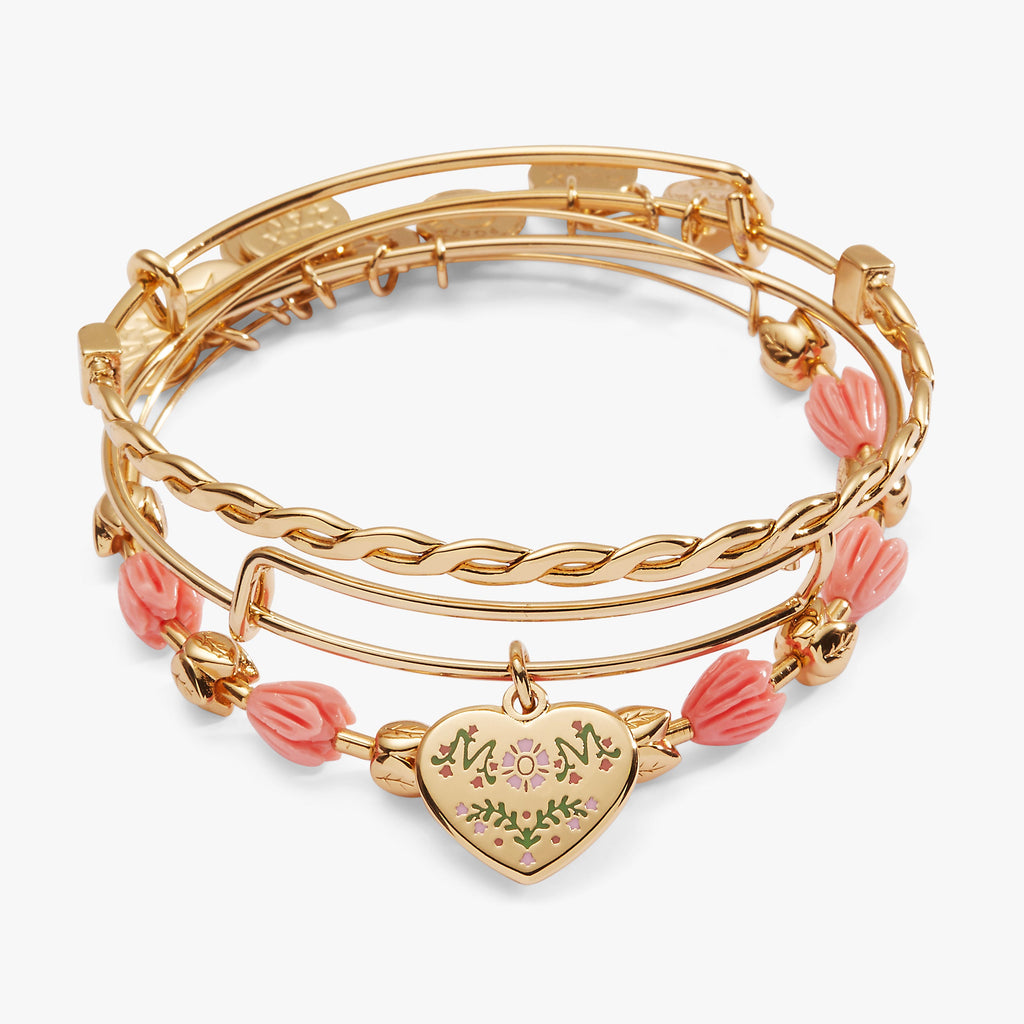 Set of three gold and pink floral bracelets including a MOM charm bangle and tulip bracelet
