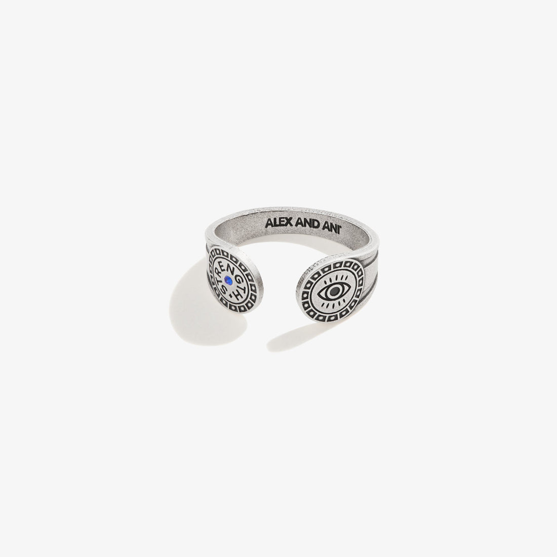 Close up of an Evil Eye Motivation wrap ring in antiqued silver with blue accent on a person's hand