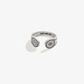 Close up of an Evil Eye Motivation wrap ring in antiqued silver with blue accent on a person's hand