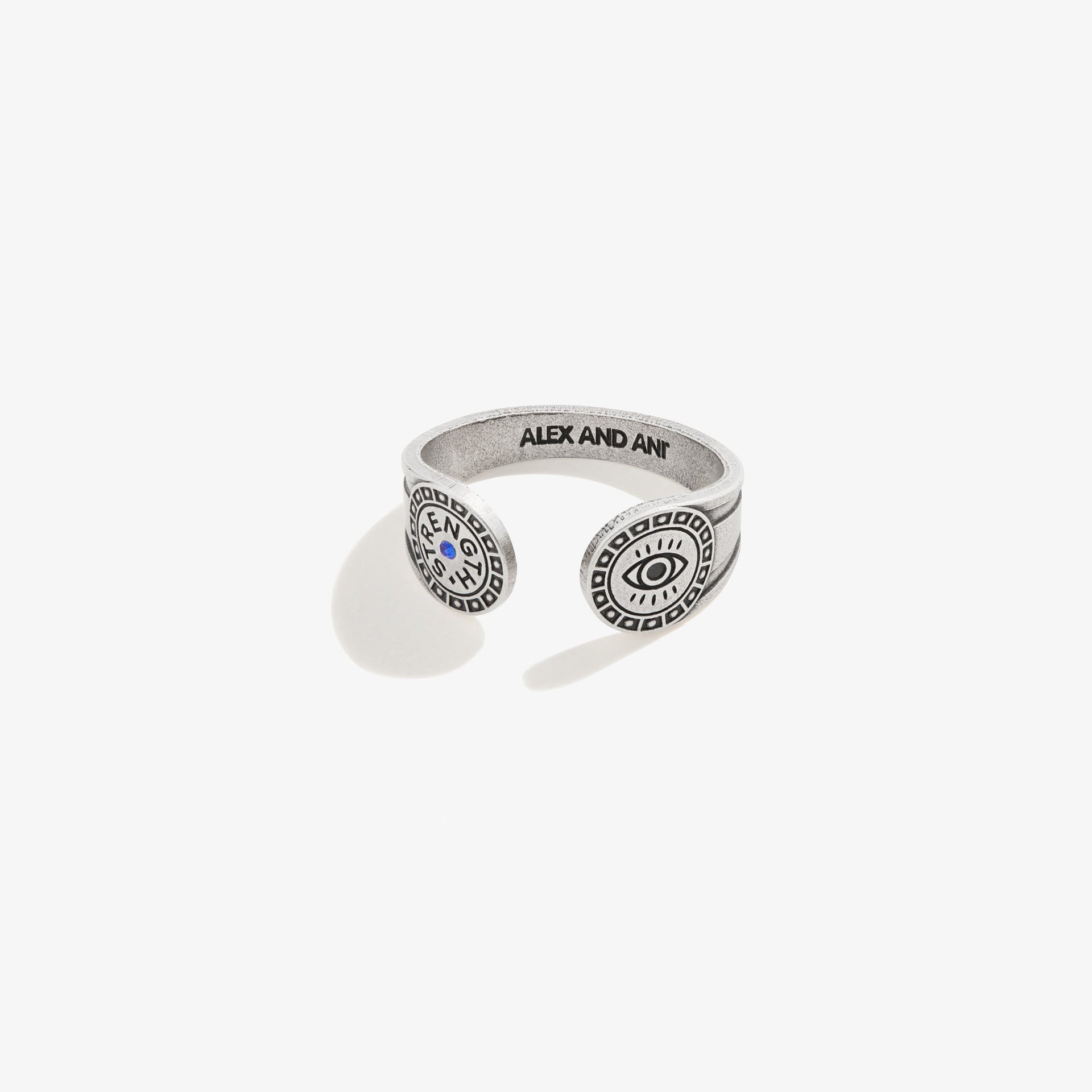 Close up of an Evil Eye Motivation wrap ring in antiqued silver with blue accent on a person's hand