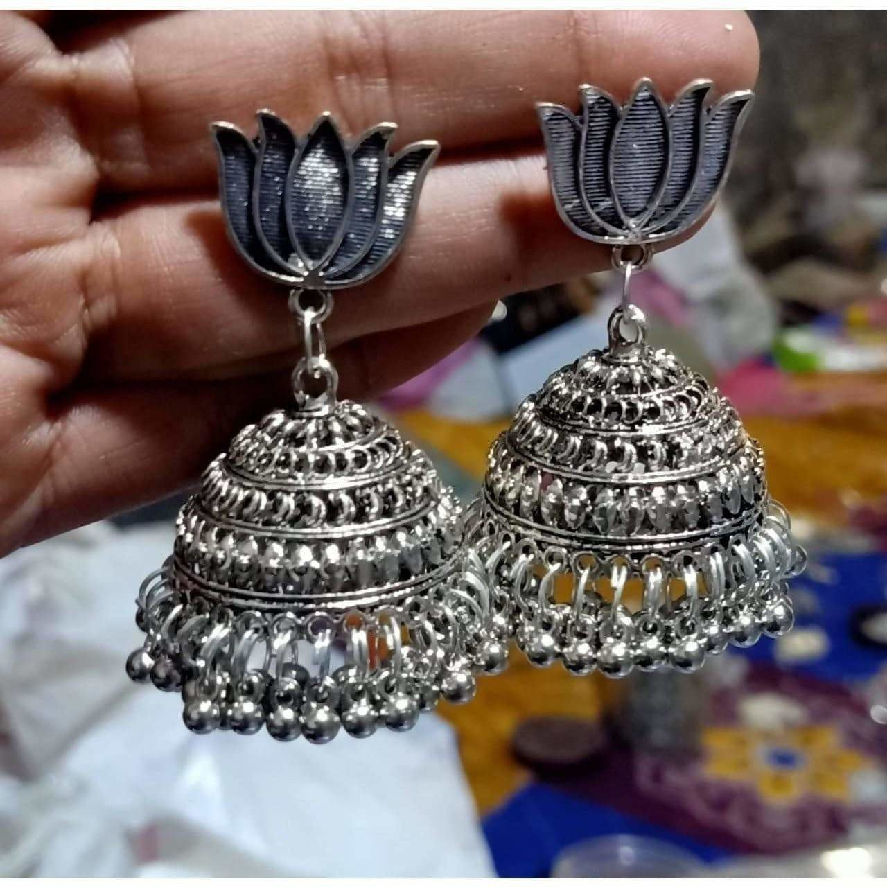 Traditional lotus design oxidized silver jhumka earrings with intricate dots