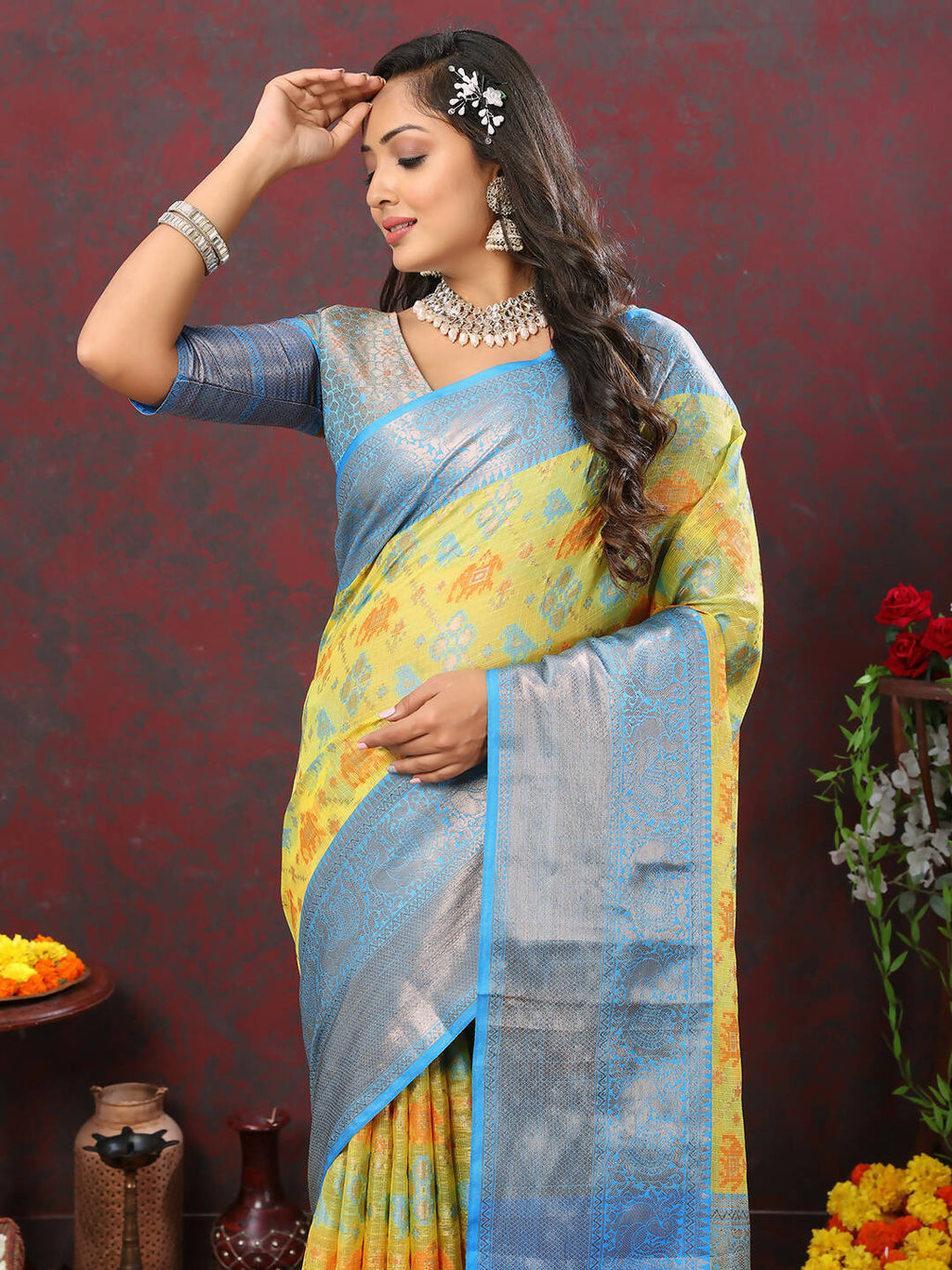 Yellow cotton saree featuring intricate Zari Meenakari weaving patterns