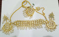 Gold plated Kundan necklace set with stone studded detailing on alloy base