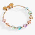 Expandable wire bangle with colorful glass heart beads, pearls, and gold-tone accents