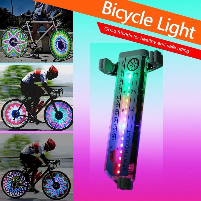 Multicolored LED bike spoke lights mounted on a mountain bike wheel at night.