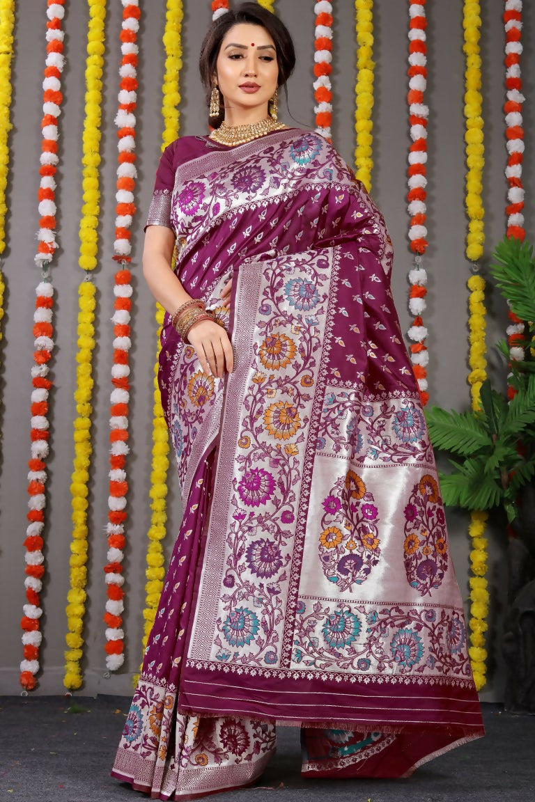 Rich wine Banarasi silk saree featuring intricate zari woven detailing and a matching blouse.