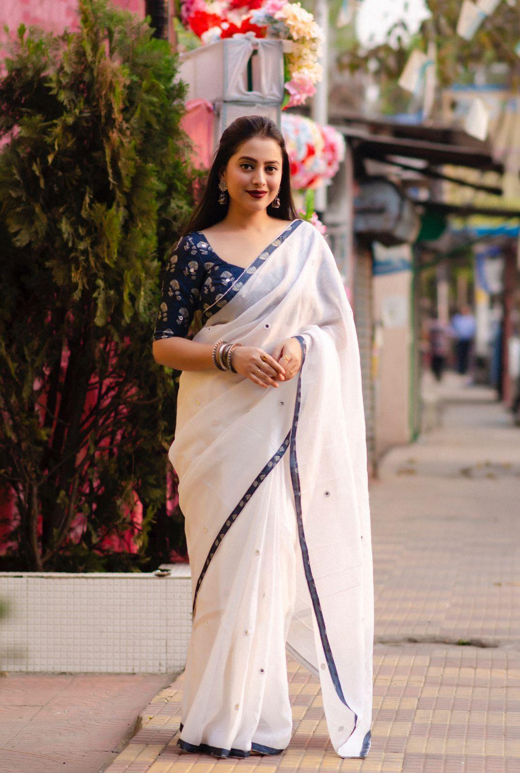 White pure linen saree with all-over mirror rings and indigo jute silk blouse
