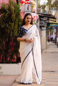 White pure linen saree with all-over mirror rings and indigo jute silk blouse