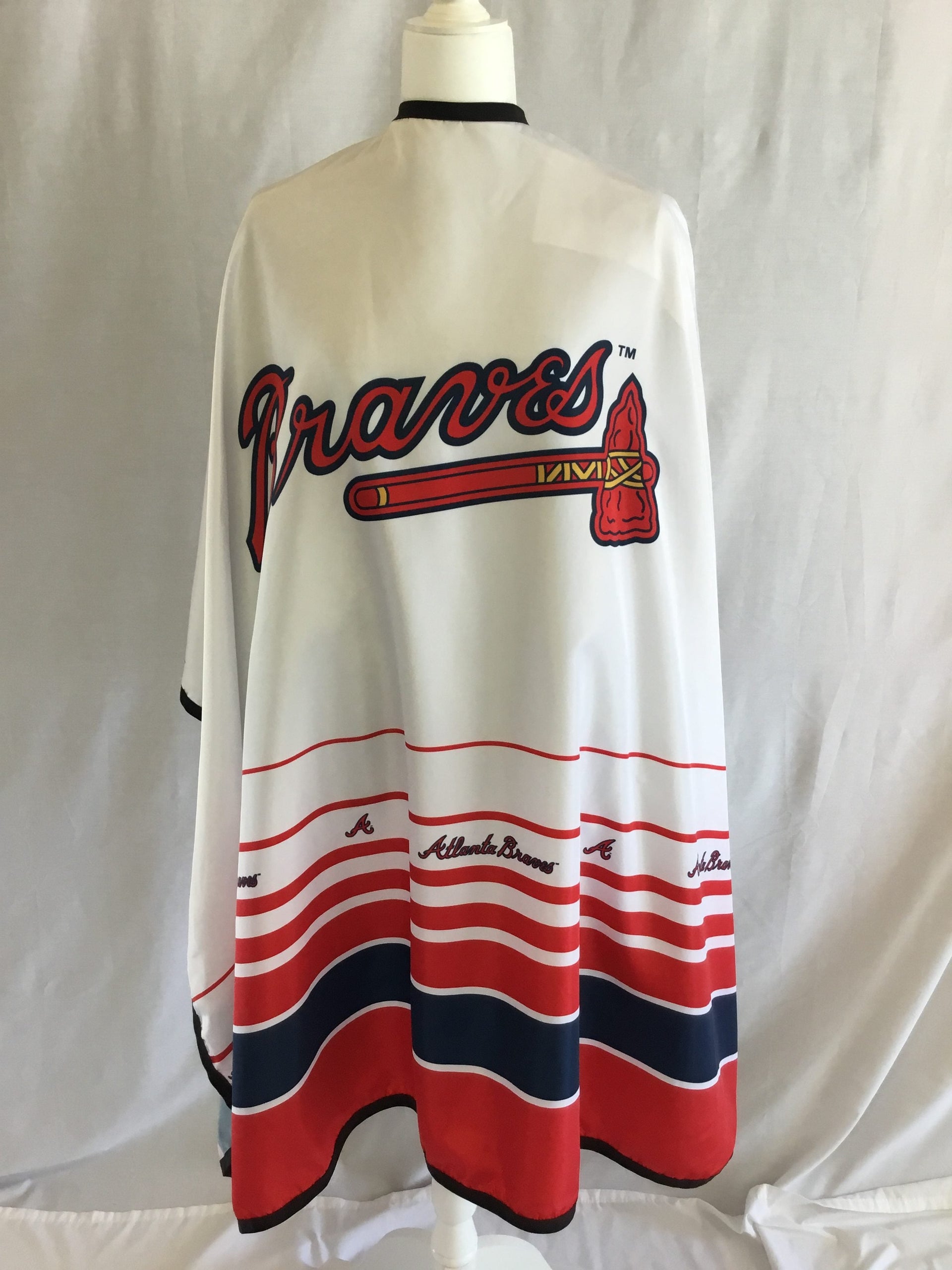 Atlanta Braves barber cape with high-quality team branding and steel snaps