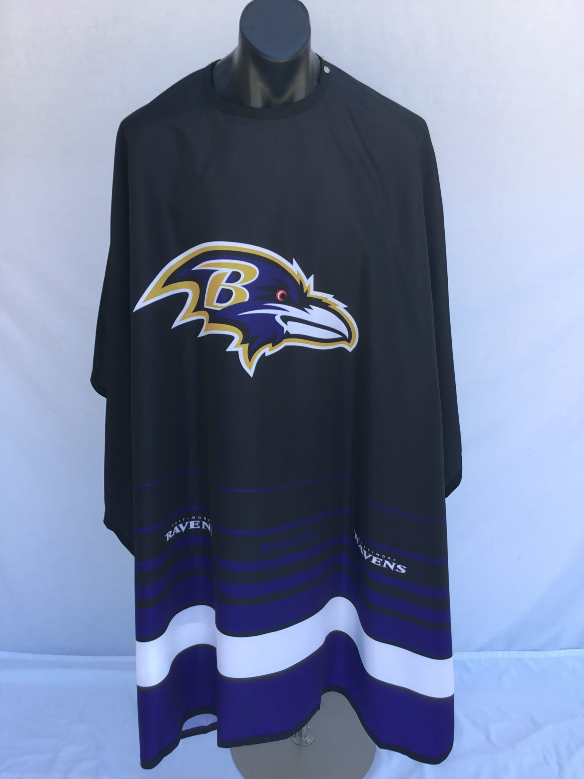 Baltimore Ravens team spirit cape in black, purple, and white with stainless steel snap closure.
