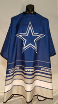Dallas Cowboys fan cape featuring team colors of blue, silver, and white with a snap closure.