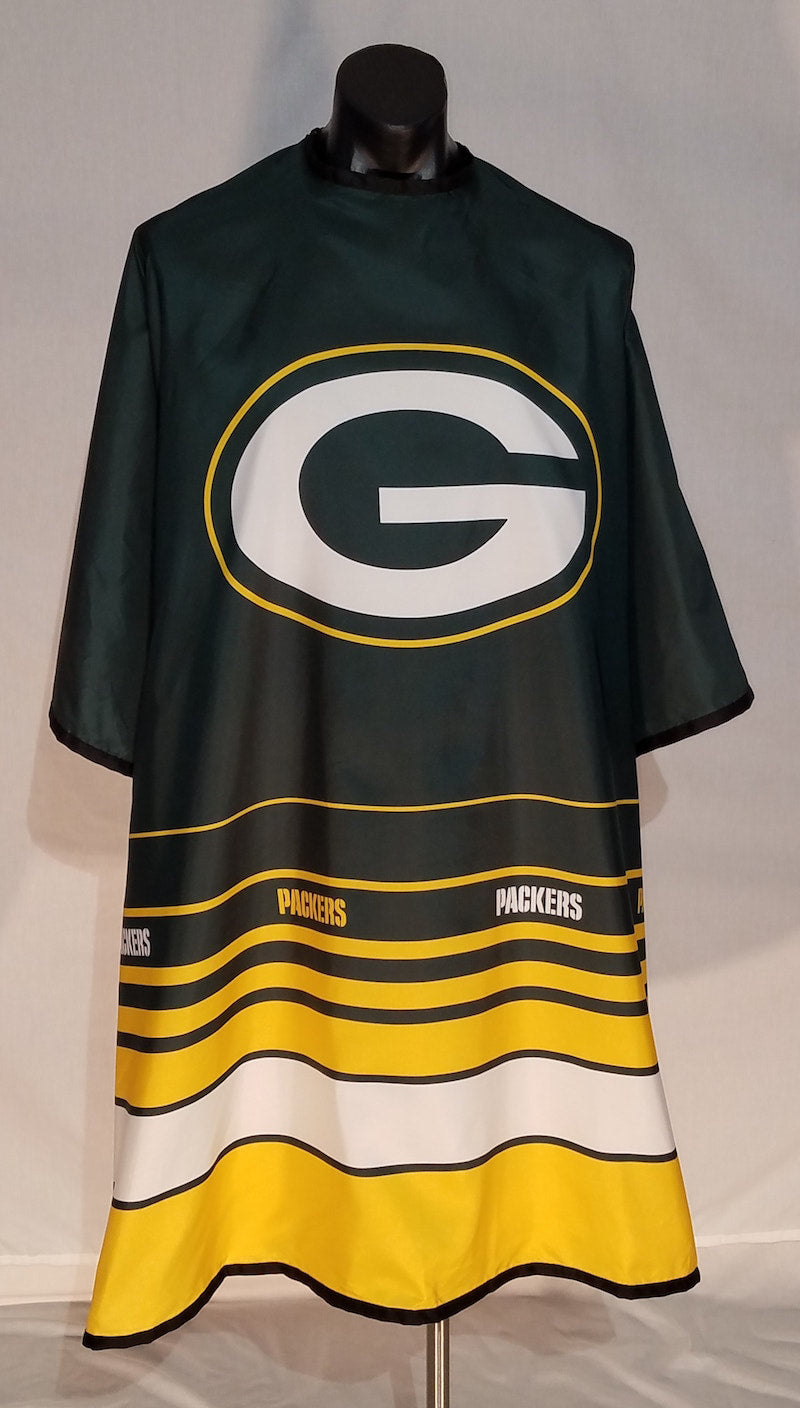 Green Bay Packers branded barber cape with stainless steel snap closure and sublimation print design.