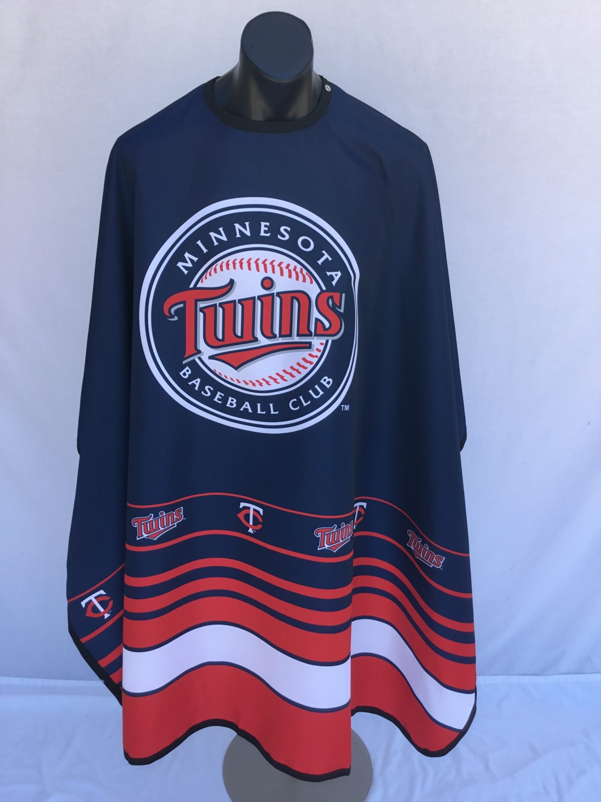 Minnesota Twins fan cape in navy, red, and white with team logo and snap closure