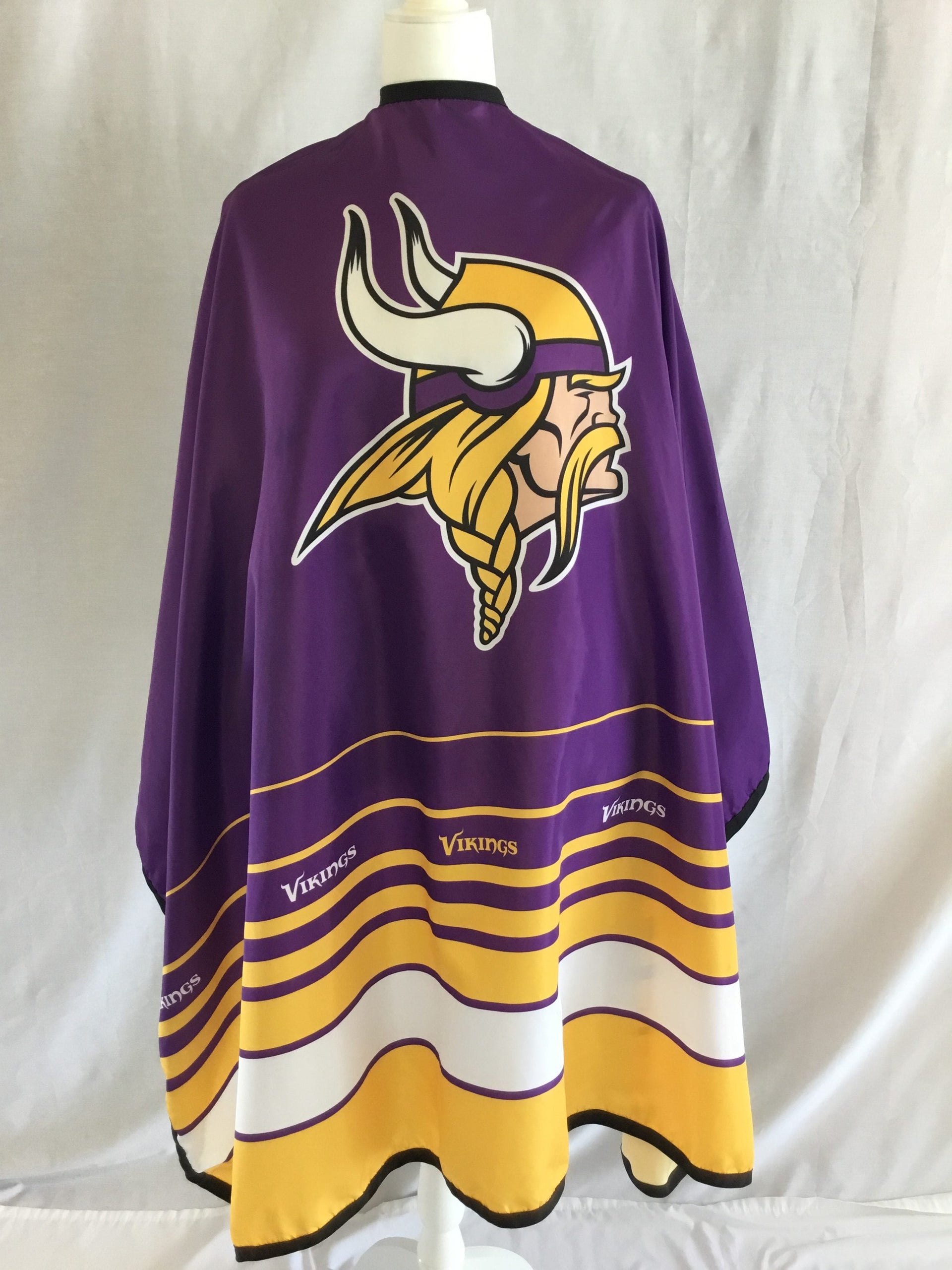 Minnesota Vikings branded barber cape with stainless steel snap closure