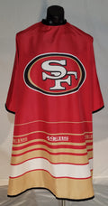 San Francisco 49ers barber cape featuring team logo and adjustable snaps