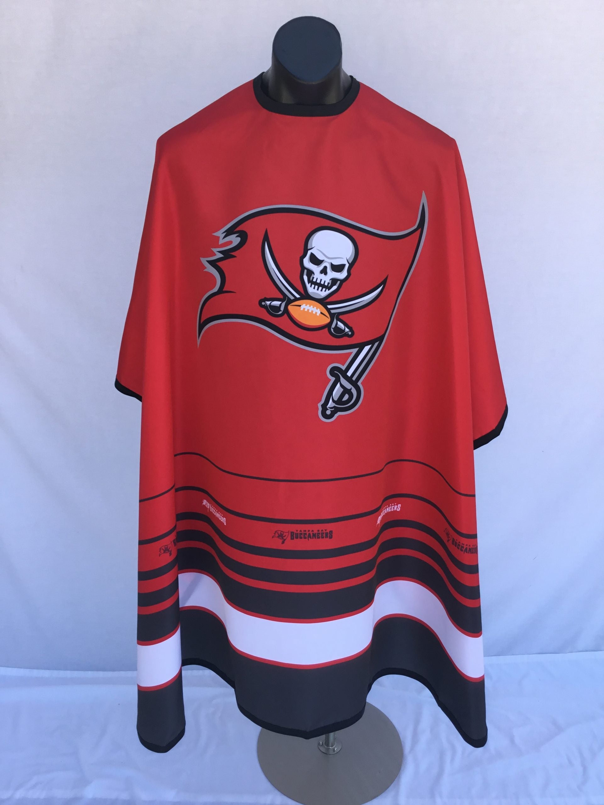 Tampa Bay Buccaneers branded barber cape with adjustable snap closure
