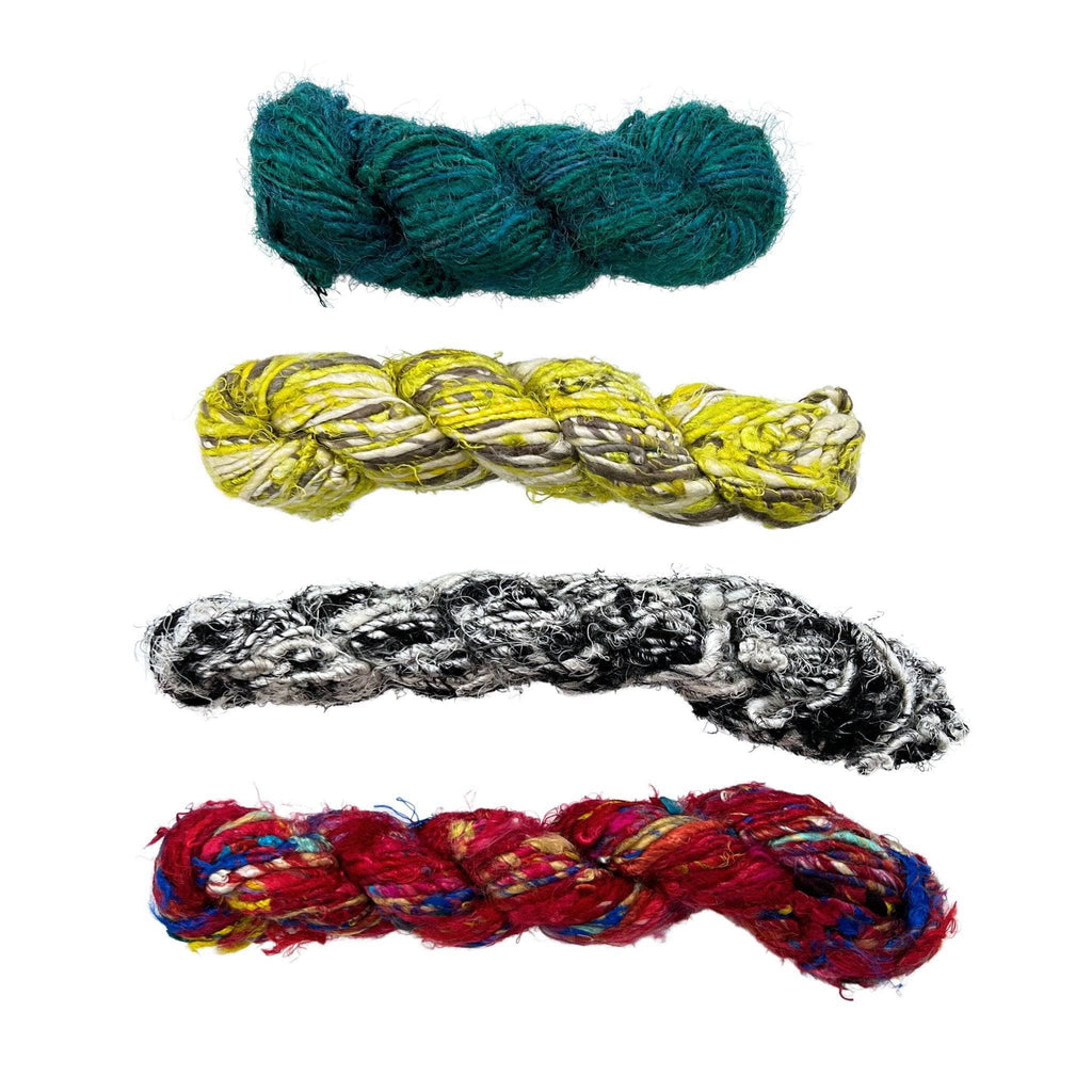 A mystery hank of variegated banana fiber yarn in vibrant teal, yellow, red, and purple jewel tones for bohemian crafts.