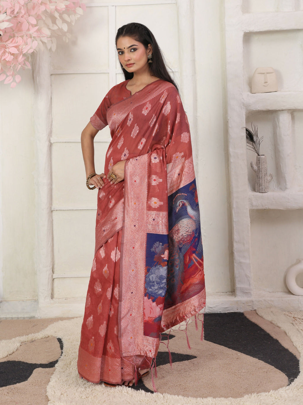 Rust colored linen cotton saree with matching blouse.