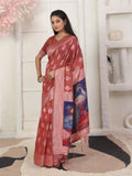 Rust colored linen cotton saree with matching blouse.