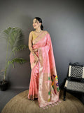 Light pink soft silk Kanchipuram saree with detailed peacock and floral motifs and matching blouse piece.