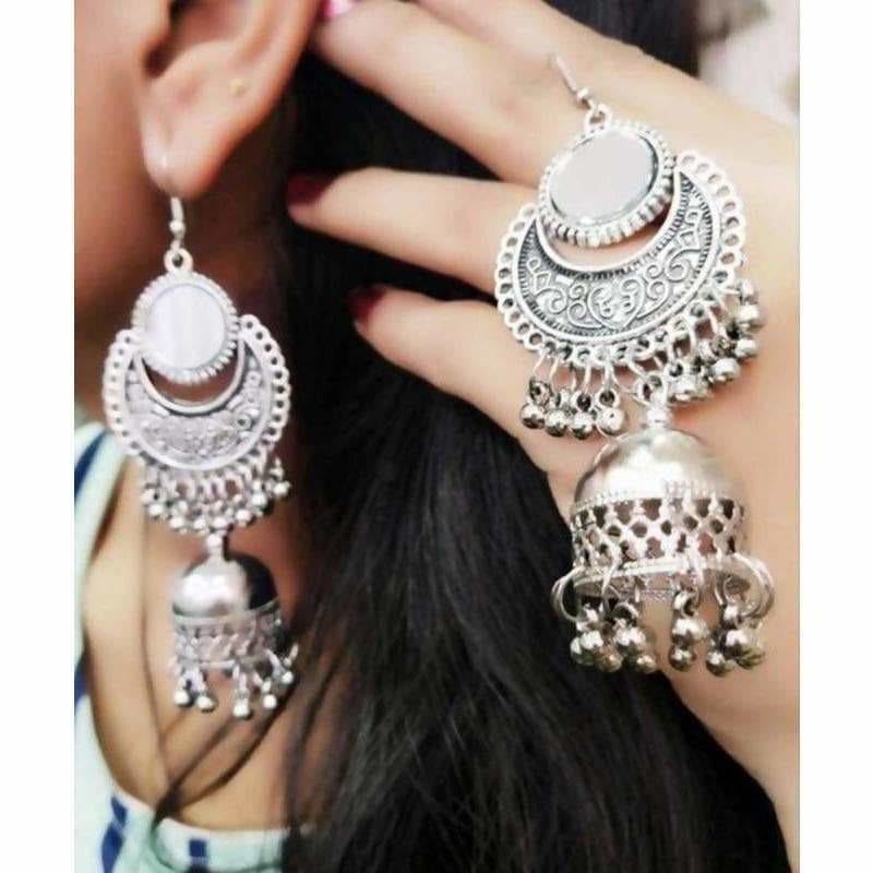 Classic oxidized silver jhumka earrings with traditional mirror work detail.