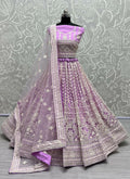 Mauve net lehenga choli with sequin embroidery and cancan flare