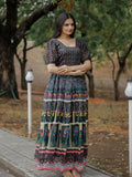 Woman wearing a black heavy digital printed pure Chanderi floor length Anarkali dress