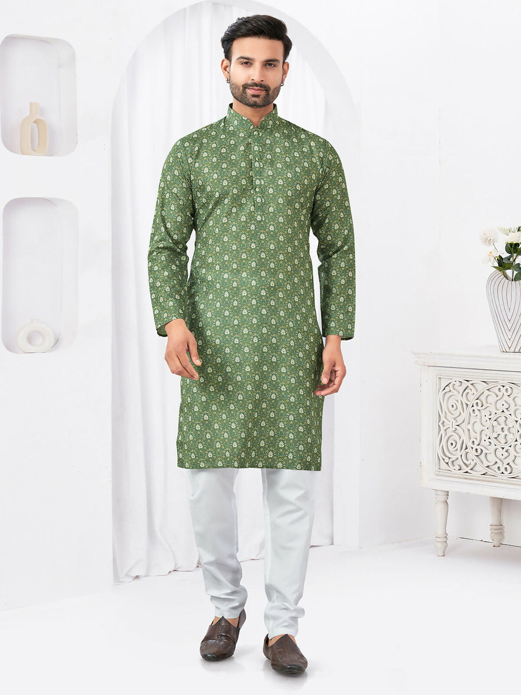 A boy wearing a vibrant green rayon cotton printed kurta set