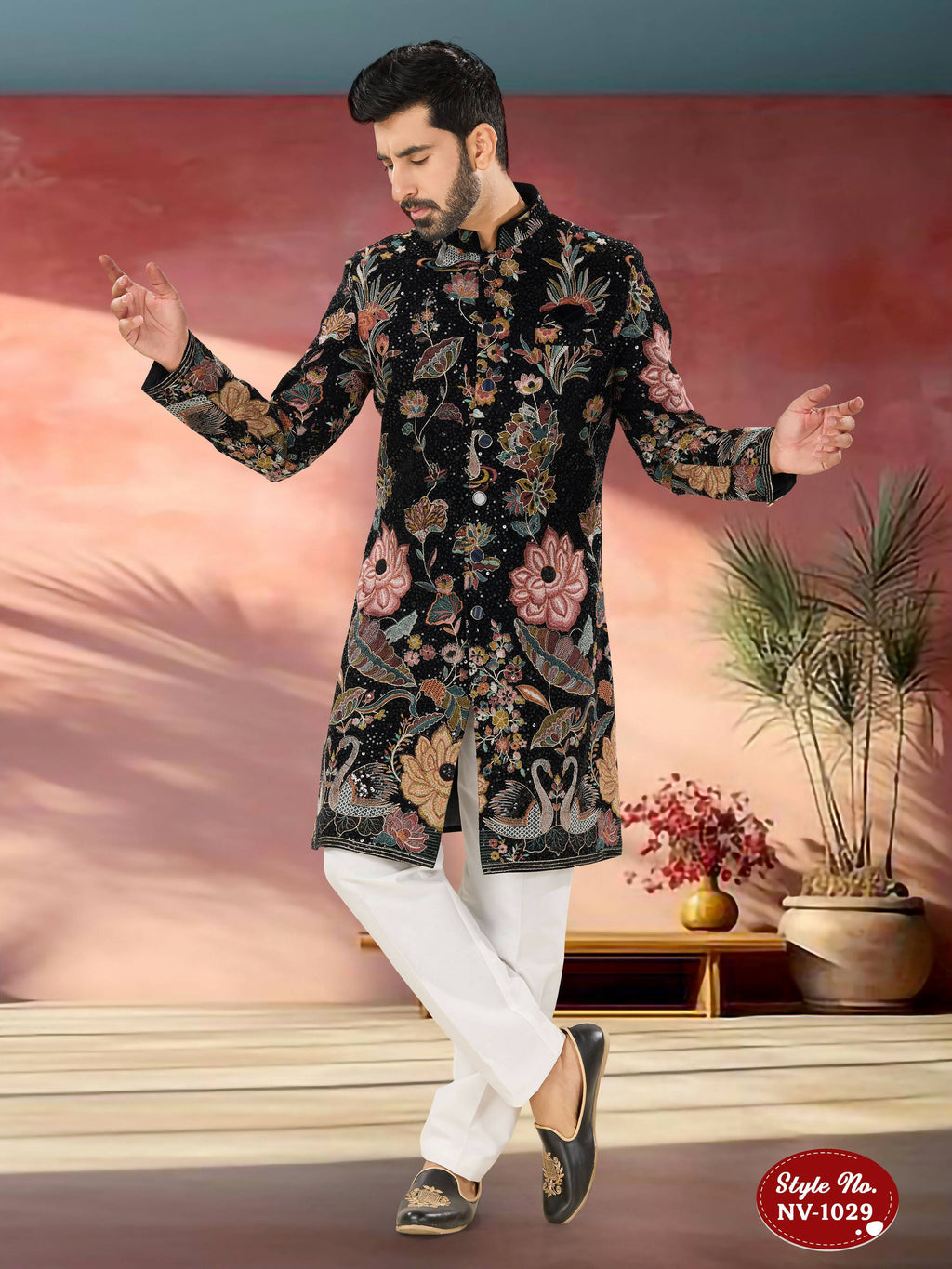 Men wearing a blue velvet Indo-Western kurta set with multi-colour thread and sequence embroidery