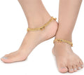 Close up of gold-polished traditional Indian foot chain, elegant ethnic imitation jewelry.