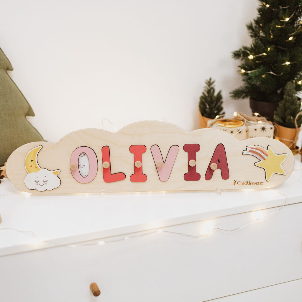 Personalized wooden cloud name puzzle on a nursery shelf