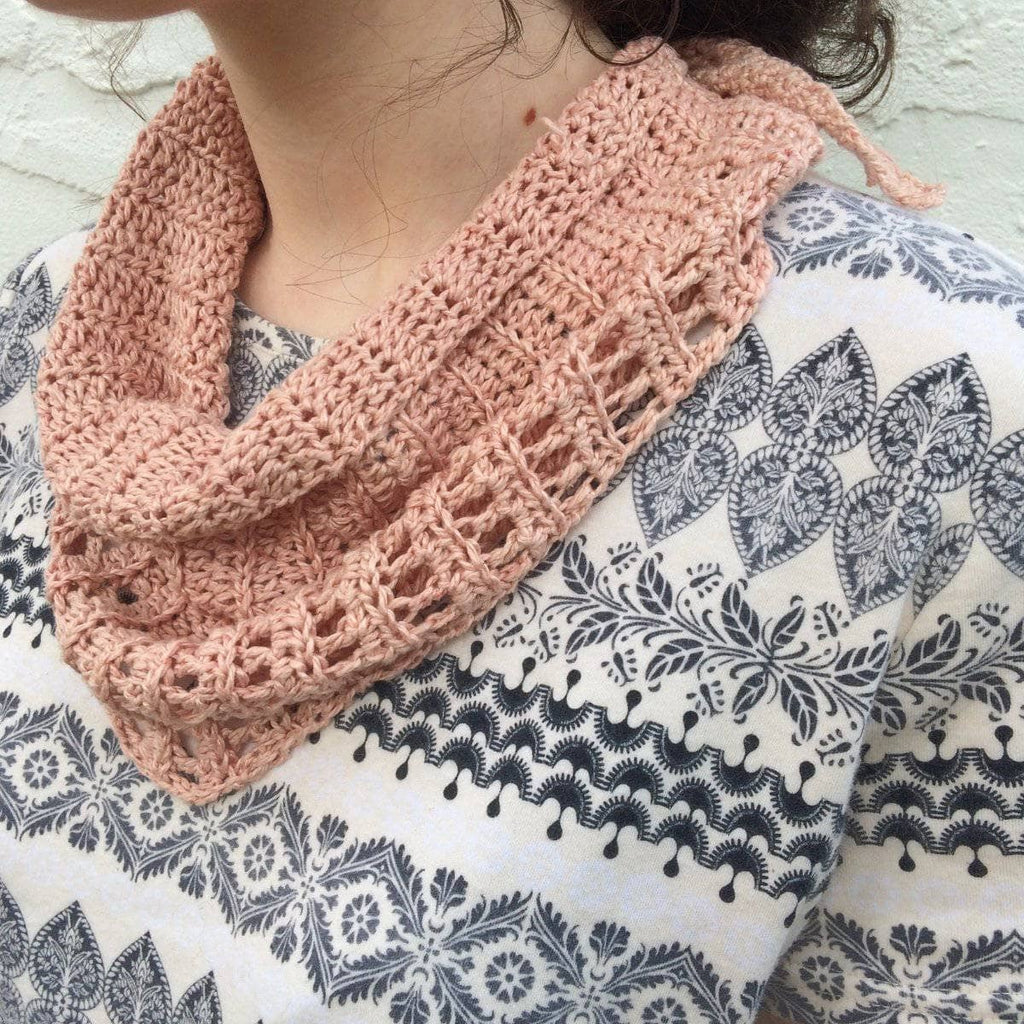 Naturally Dyed Lemongrass Scarf resting on a surface, showcasing the crochet texture and soft silk yarn.